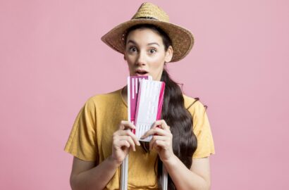shocked-woman-holding-her-plane-tickets